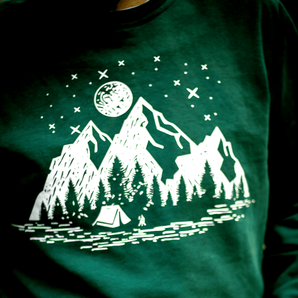 Sweater with Mountain scene printed on it