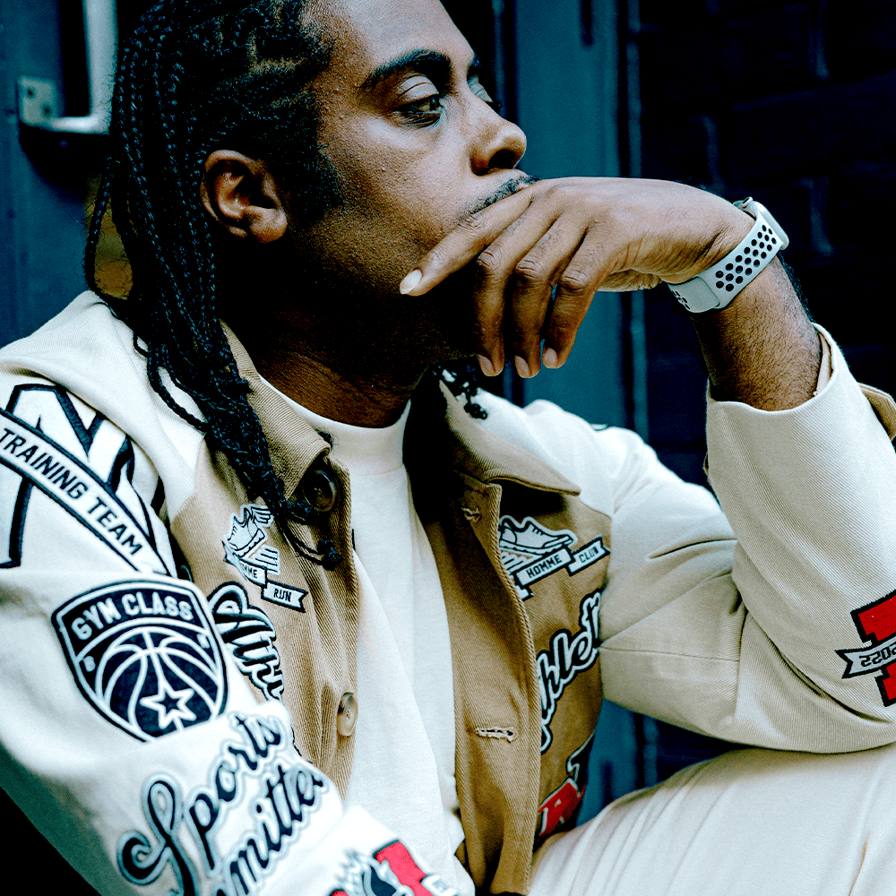 Man in a jacket with logoed patches