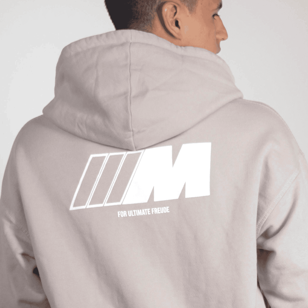 Man wearing logoed hoodie