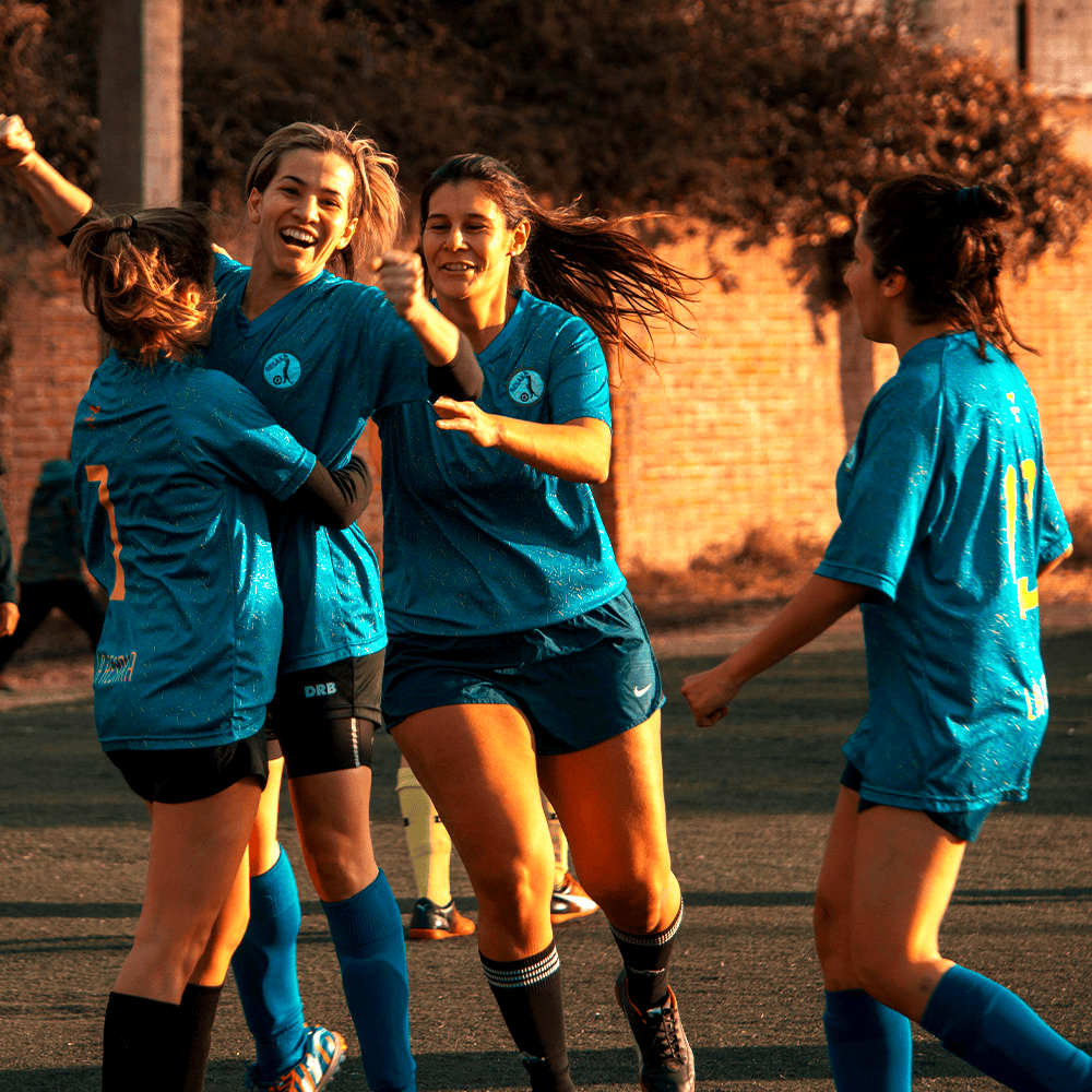 Happy youth celebrating soccer victory